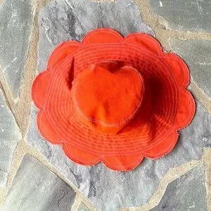 Anthropologie-Reversible Flower Canvas Bucket Hat- Peachy Orange Anthropologie reversible canvas bucket hat peach at Best  main image 2